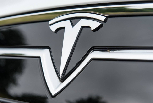 Logo of Tesla electric vehicle company is pictured on an S model vehicle